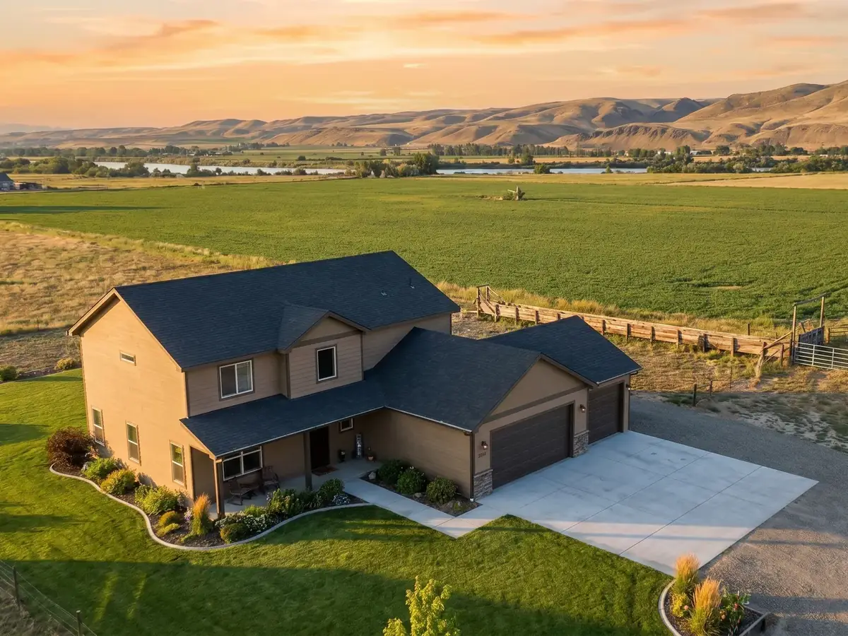 A Kuna home beside irrigated farmland at golden hour