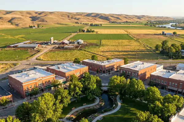 Aerial view of downtown Caldwell with farmland and foothills beyond