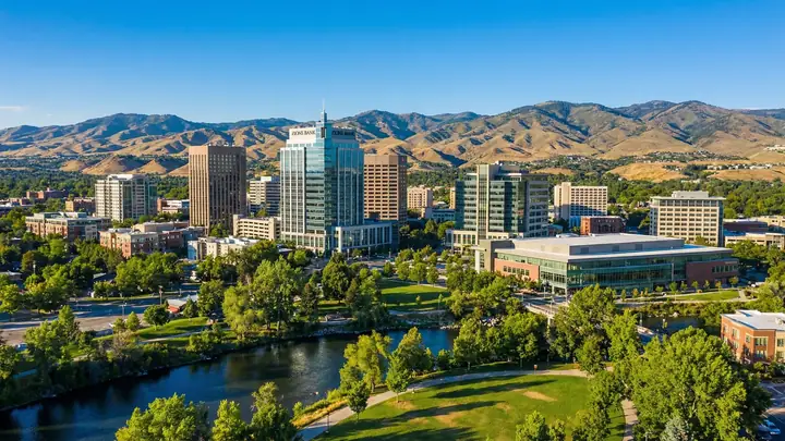 Aerial view of the Boise skyline and the river, the foothills behind